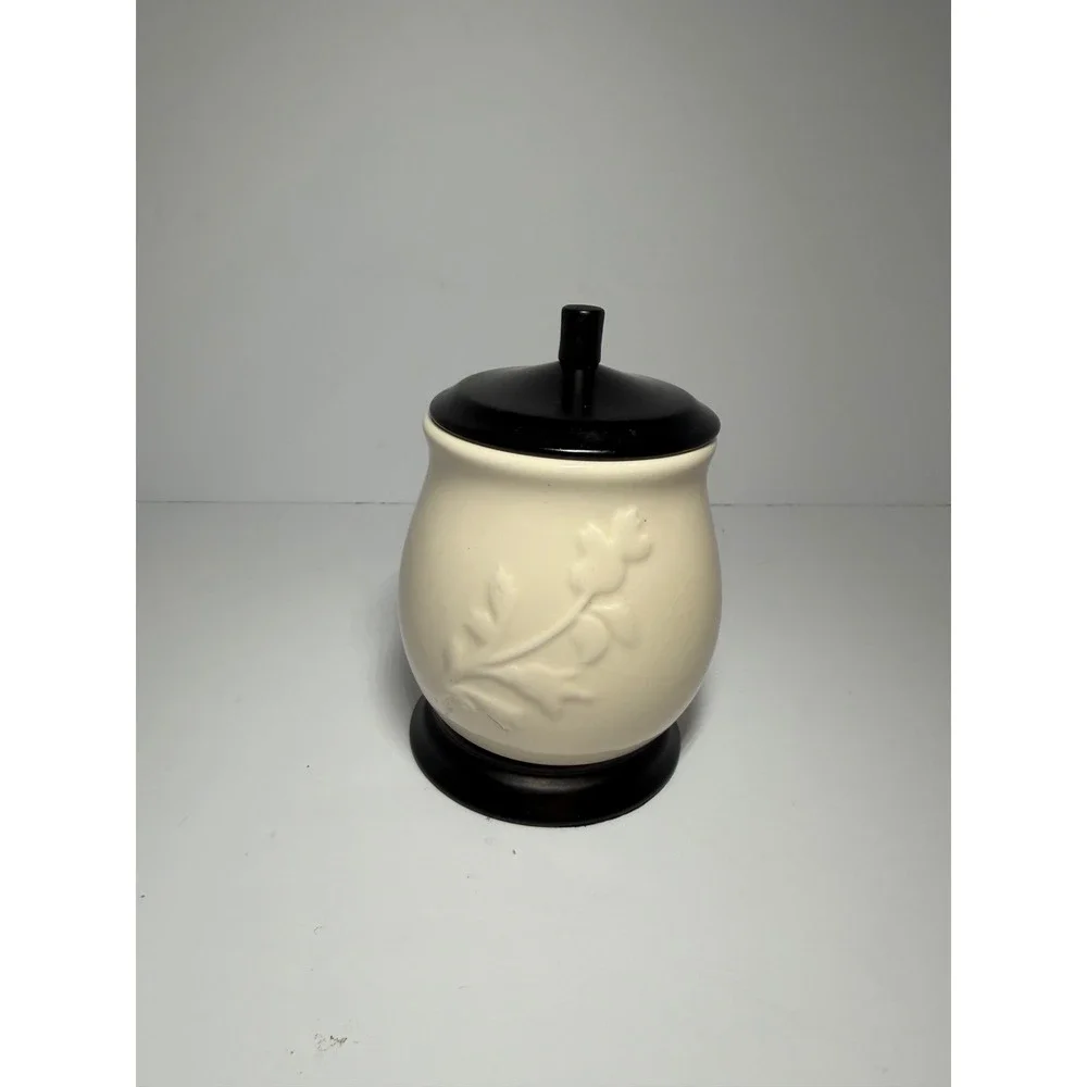 Cream Ceramic Jar with Embossed Floral Vine and Dark Brown Lid and Base